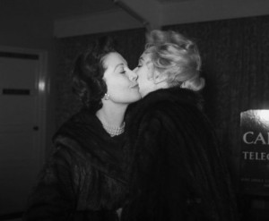 Vivien Leigh kisses Marilyn goodbye as she flies to the US after filming 'The Prince and the Showgirl', November 1956