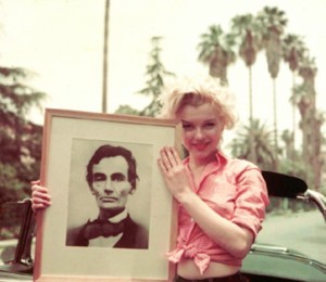 Great Americans: Marilyn holding her lithograph of Abraham Lincoln. Photo by Milton Greene, 1954