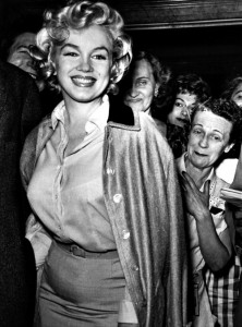 Marilyn leaves hospital in her much-loved silk coat, 1959